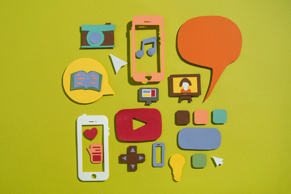 Colorful paper craft icons representing social media and digital tools.